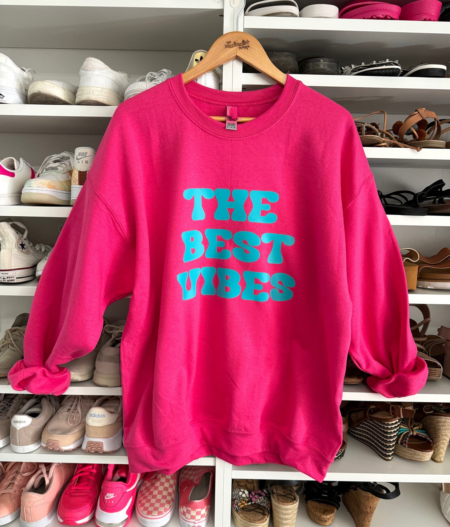Pink sweatshirt with teal graphic 